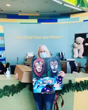 A Change 4 Love painting delivered to a child