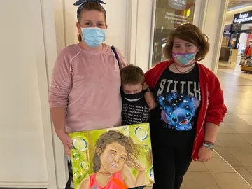 A Change 4 Love painting delivered to a child