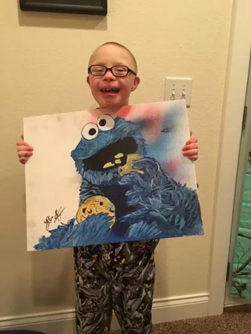 A Change 4 Love painting delivered to a child