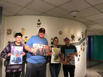 A Change 4 Love painting delivered to a child