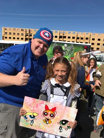A Change 4 Love painting delivered to a child