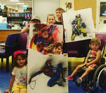 A Change 4 Love painting delivered to a child