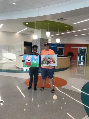 A Change 4 Love painting delivered to a child