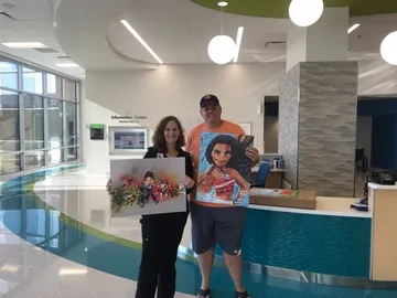 A Change 4 Love painting delivered to a child