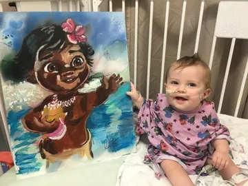 A Change 4 Love painting delivered to a child