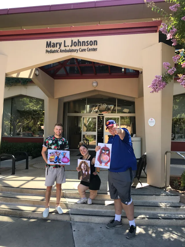 A hand-painted superhero gift delivered outside a children's hospital