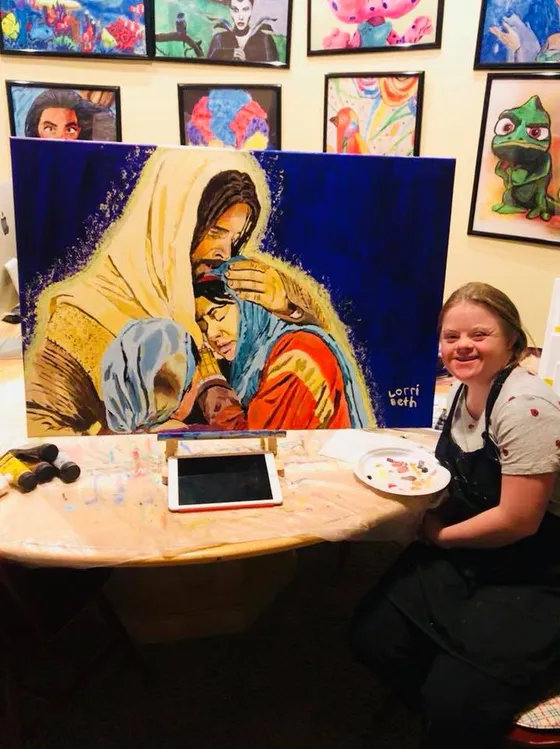 A Change 4 Love artist at work on a painting