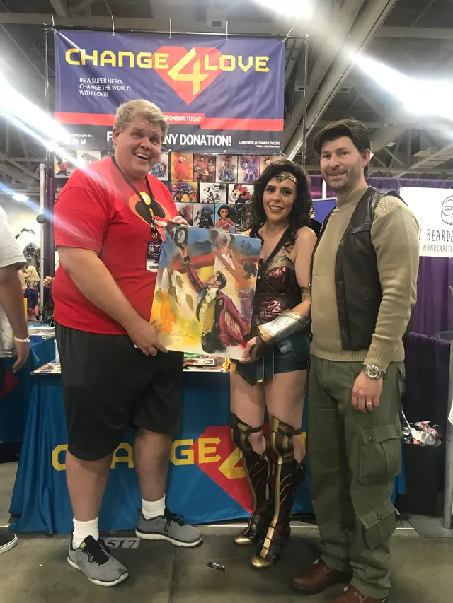 A Wonder Woman painting shared at a Change 4 Love convention booth